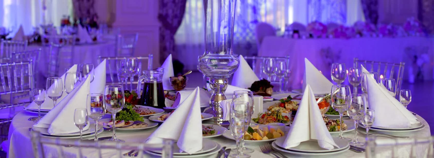 Elegant catered banquet table set with plated dishes and glassware at a Delaware event
